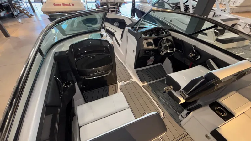 Slide: The Image of 2025 Monterey 298 Super Sport boat interior with sleek seating and modern dashboard. - 10