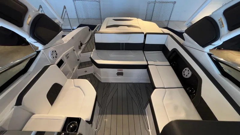Slide: The Image of 2025 Monterey 298 Super Sport boat interior with sleek seating and modern design. - 12