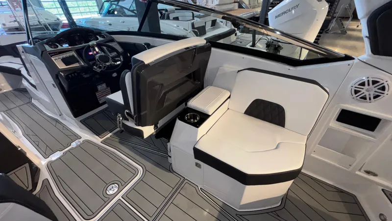 Slide: The Image of 2025 Monterey 298 Super Sport boat interior with sleek seating and modern dashboard design. - 13