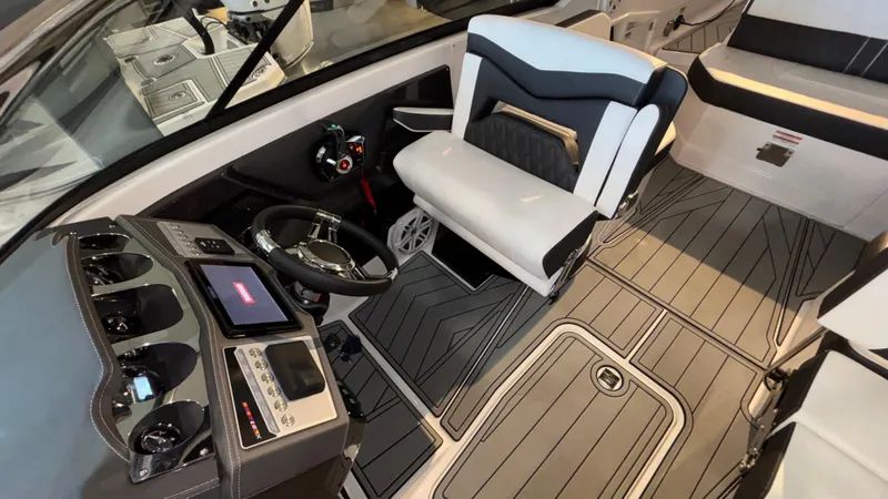 Slide: The Image of 2025 Monterey 298 Super Sport boat interior with modern dashboard and seating. - 15