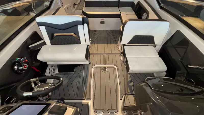 Slide: The Image of 2025 Monterey 298 Super Sport boat interior with sleek seating and modern design. - 16
