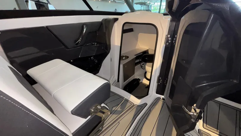 Slide: The Image of 2025 Monterey 298 Super Sport interior with seating and cabin view. - 17