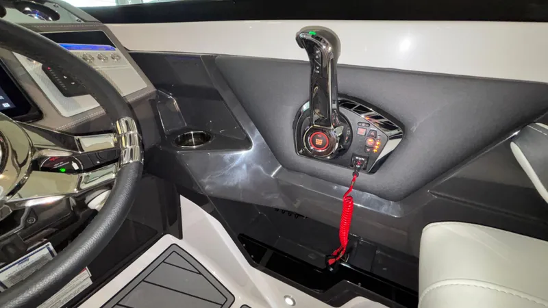 Slide: The Image of Interior of 2025 Monterey 298 Super Sport boat, featuring steering wheel and control panel. - 21