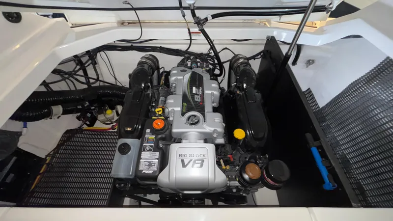 Slide: The Image of Engine compartment of 2025 Monterey 298 Super Sport boat, featuring a powerful V8 engine. - 28