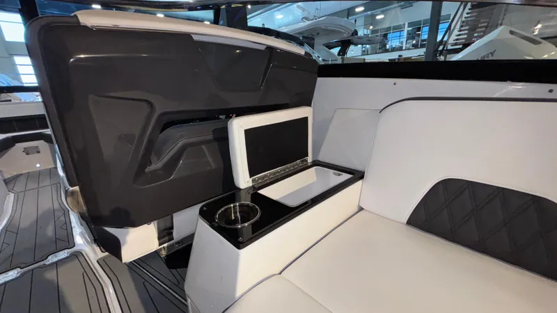 Slide: The Image of 2025 Monterey 298 Super Sport interior with sleek seating and integrated cup holder. - 30