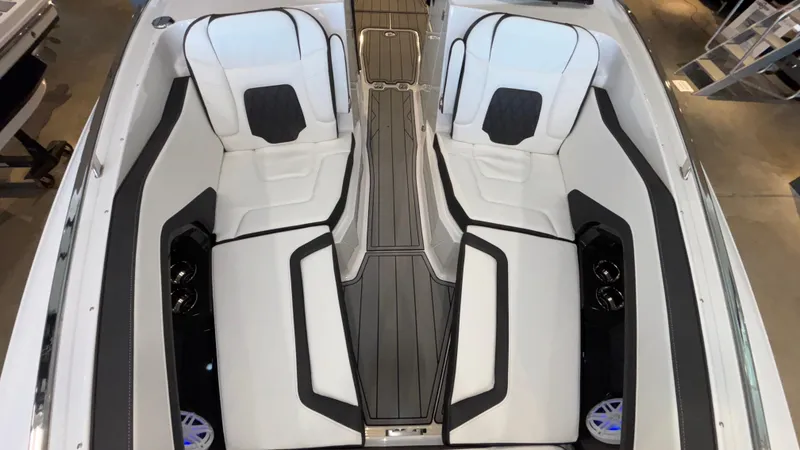 Slide: The Image of 2025 Monterey 298 Super Sport boat interior with sleek white seating and modern design. - 35