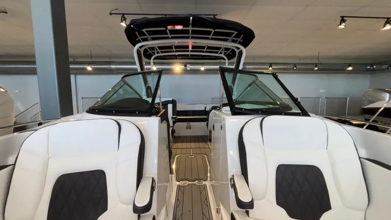 Slide: The Image of 2025 Monterey 298 Super Sport boat interior with white seating and sleek design. - 38