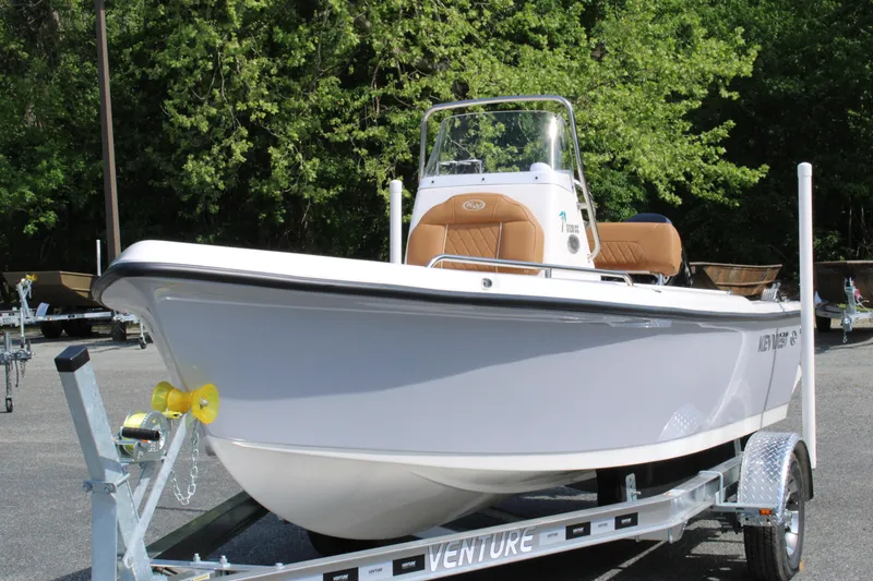 Slide: The Image of 2025 Key West 1720 Center Console boat on trailer, parked outdoors. - 0