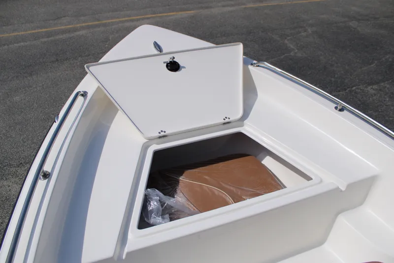 Slide: The Image of 2025 Key West 1720 Center Console boat storage compartment open on deck. - 16