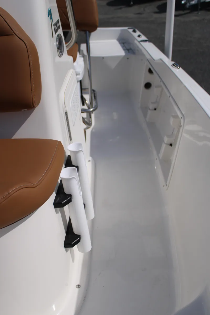 Slide: The Image of 2025 Key West 1720 Center Console boat interior with brown seating and white deck. - 21