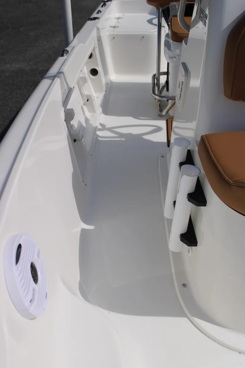 Slide: The Image of 2025 Key West 1720 Center Console boat interior with white deck and brown seating. - 22