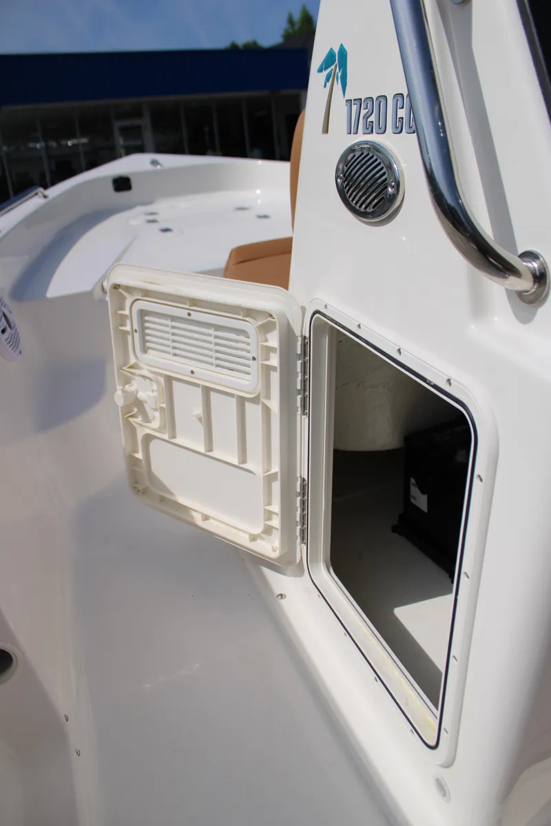 Slide: The Image of 2025 Key West 1720 Center Console boat with open storage compartment. - 23