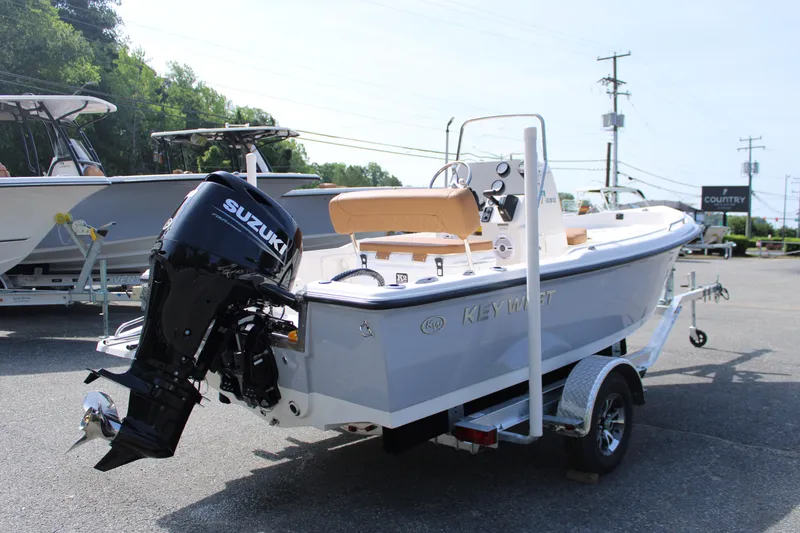 Slide: The Image of 2025 Key West 1720 Center Console boat with Suzuki outboard motor on trailer. - 3