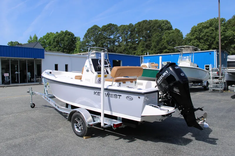 Slide: The Image of 2025 Key West 1720 Center Console boat on trailer, outdoor dealership setting. - 4