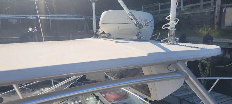 Slide: The Image of 1999 Boston Whaler 23 Conquest boat with radar equipment on top. - 8