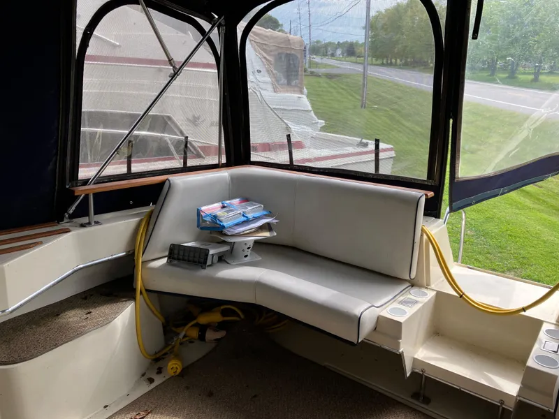 Slide: The Image of 1985 Cruisers 336 Ultra Vee boat interior with seating and nautical equipment. - 10