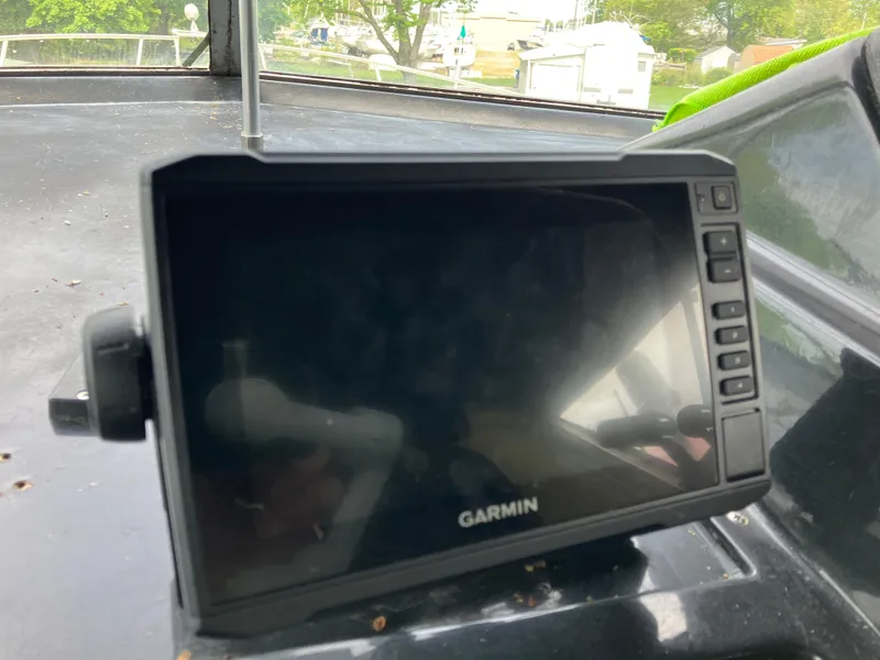 Slide: The Image of Garmin navigation device on 1985 Cruisers 336 Ultra Vee boat dashboard. - 12