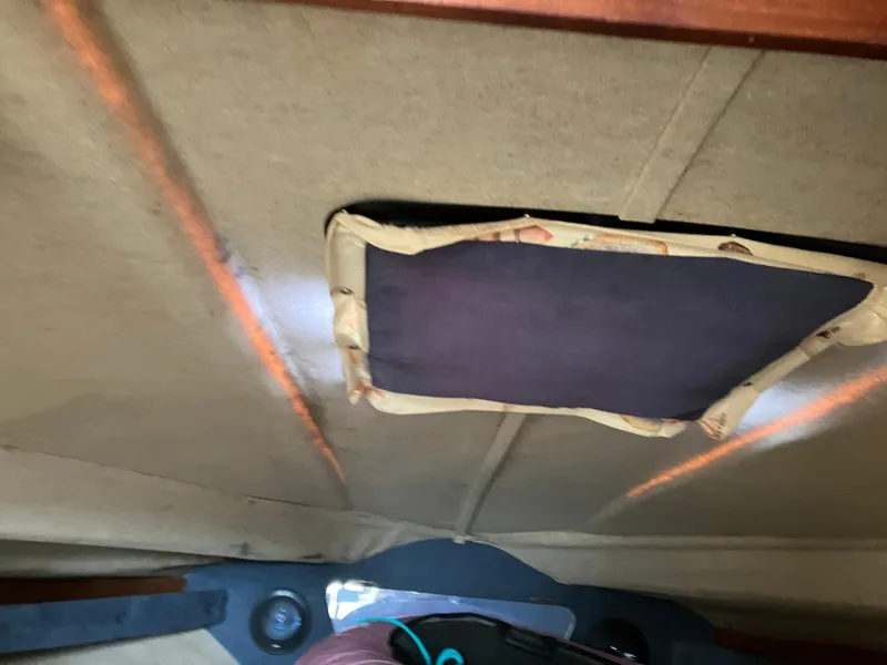 Slide: The Image of Interior view of 1985 Cruisers 336 Ultra Vee boat ceiling with fabric panel. - 24