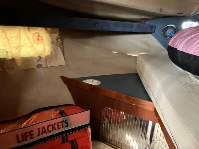 Slide: The Image of Interior cabin of 1985 Cruisers 336 Ultra Vee with life jackets and bedding. - 25