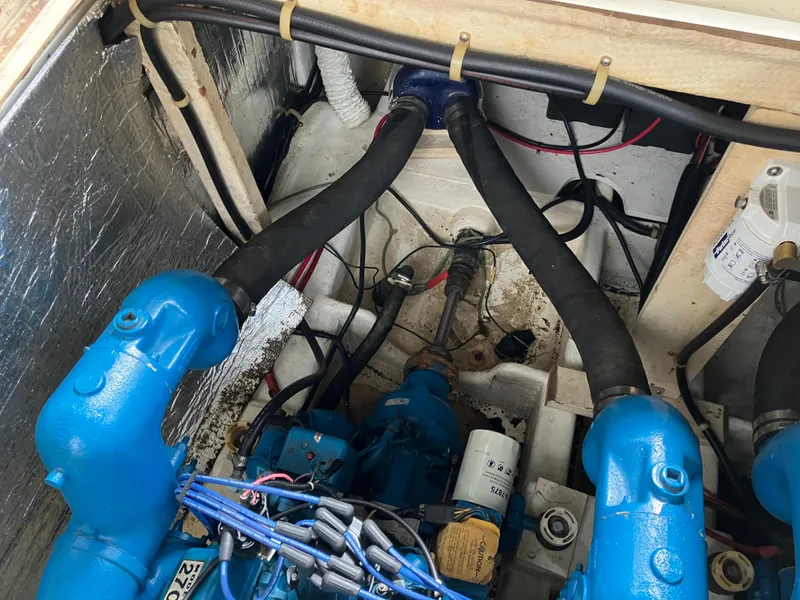 Slide: The Image of Engine compartment of a 1985 Cruisers 336 Ultra Vee with visible blue components. - 38