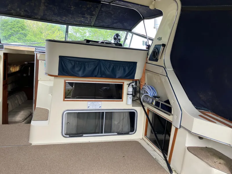 Slide: The Image of 1985 Cruisers 336 Ultra Vee boat interior with seating, storage, and navigation area. - 9