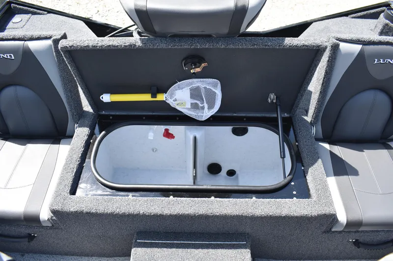 Slide: The Image of 2025 Lund 1875 Renegade SS boat interior with storage compartment and fishing net. - 14