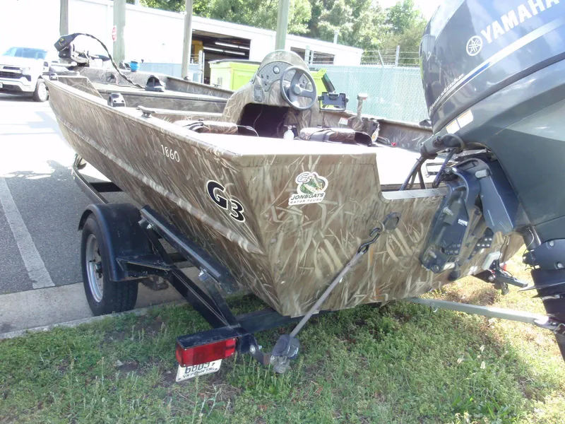 Slide: The Image of 2013 G3 1860 SC camo boat with Yamaha motor on trailer. - 8