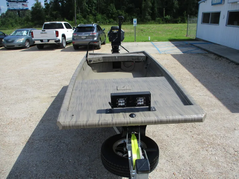 Slide: The Image of 2025 Gator Tail 1754 Extreme boat on trailer in parking lot. - 3