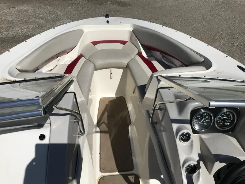 Slide: The Image of 2005 Larson Senza 186 I/O boat interior with seating and dashboard. - 13