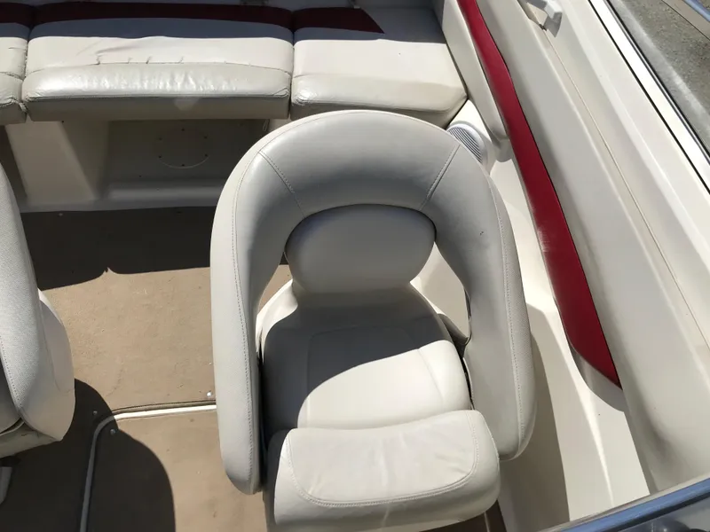 Slide: The Image of 2005 Larson Senza 186 I/O boat interior with white seating and red accents. - 14