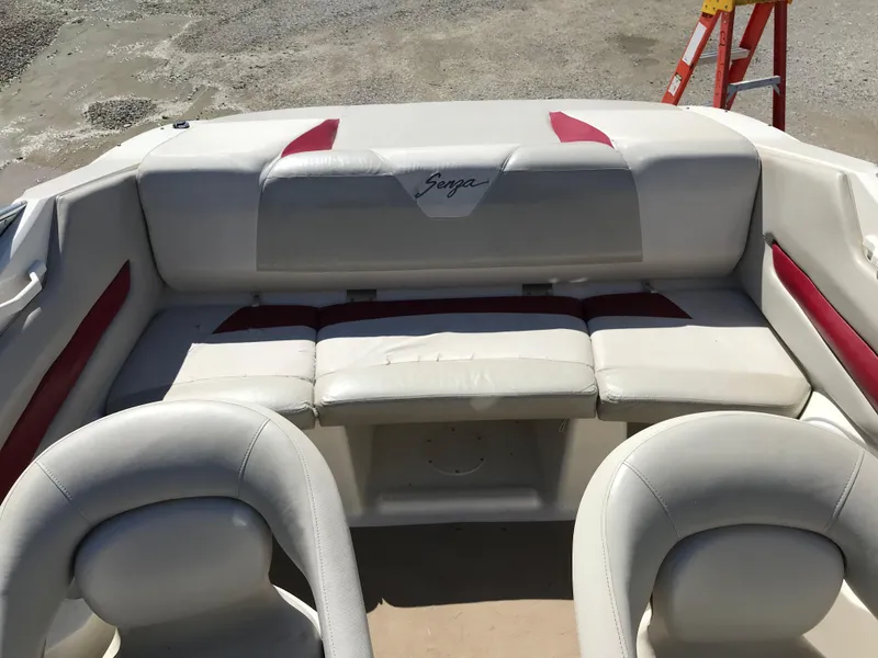 Slide: The Image of 2005 Larson Senza 186 I/O boat interior with white and red seating. - 16