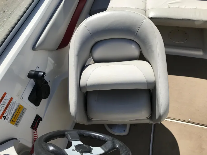 Slide: The Image of Captain's seat and steering wheel of 2005 Larson Senza 186 I/O boat. - 17