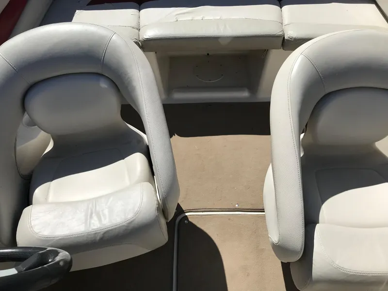 Slide: The Image of 2005 Larson Senza 186 I/O boat interior with white seats and beige carpet. - 20