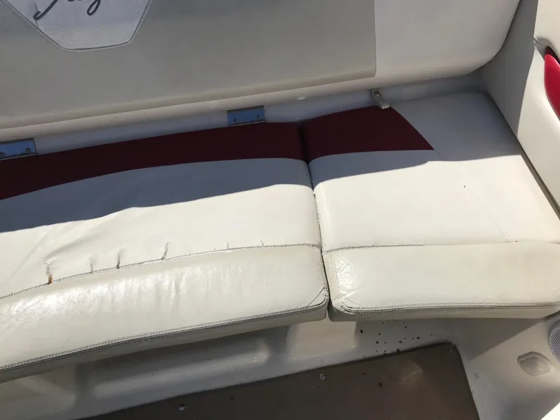 Slide: The Image of 2005 Larson Senza 186 I/O boat interior with white and red seating. - 22