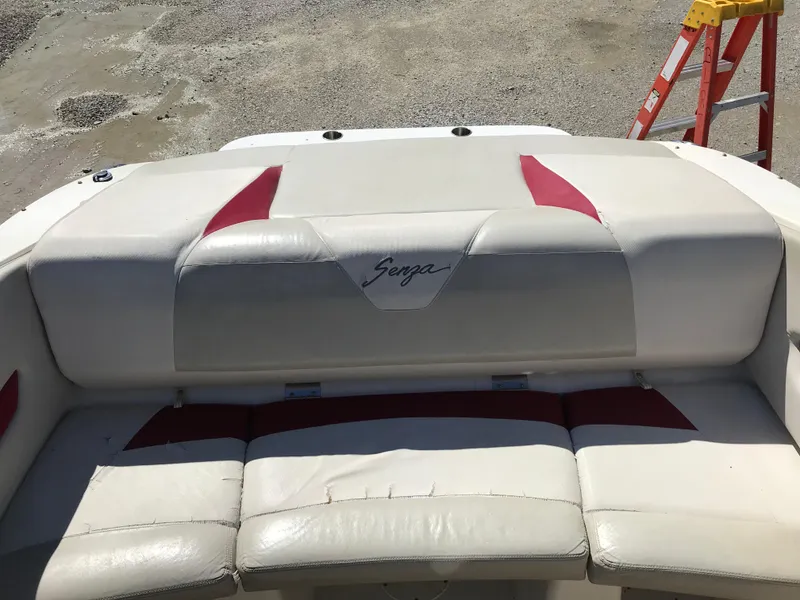 Slide: The Image of 2005 Larson Senza 186 I/O boat interior with white and red seating. - 23