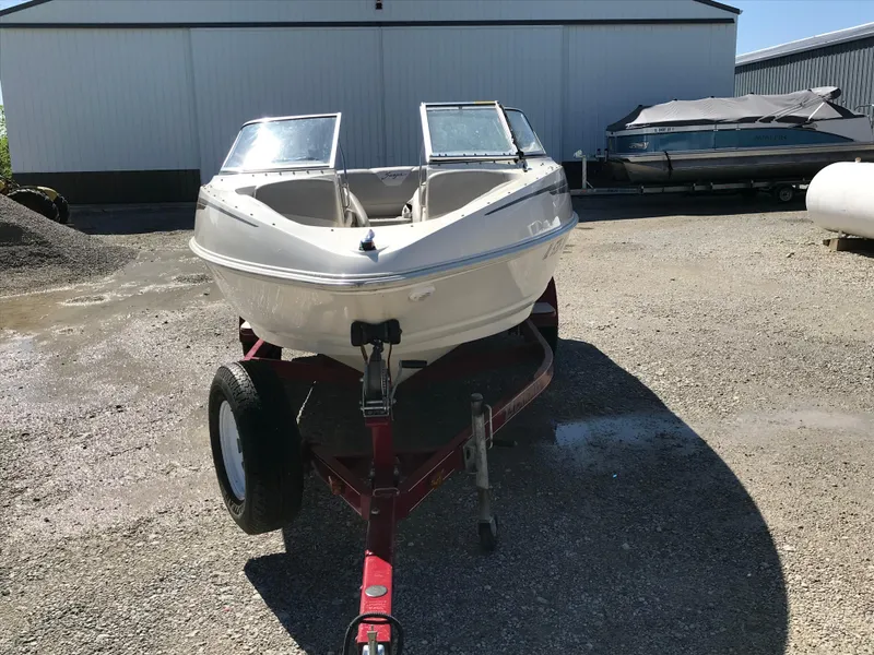 Slide: The Image of 2005 Larson Senza 186 I/O boat on trailer in outdoor storage area. - 5