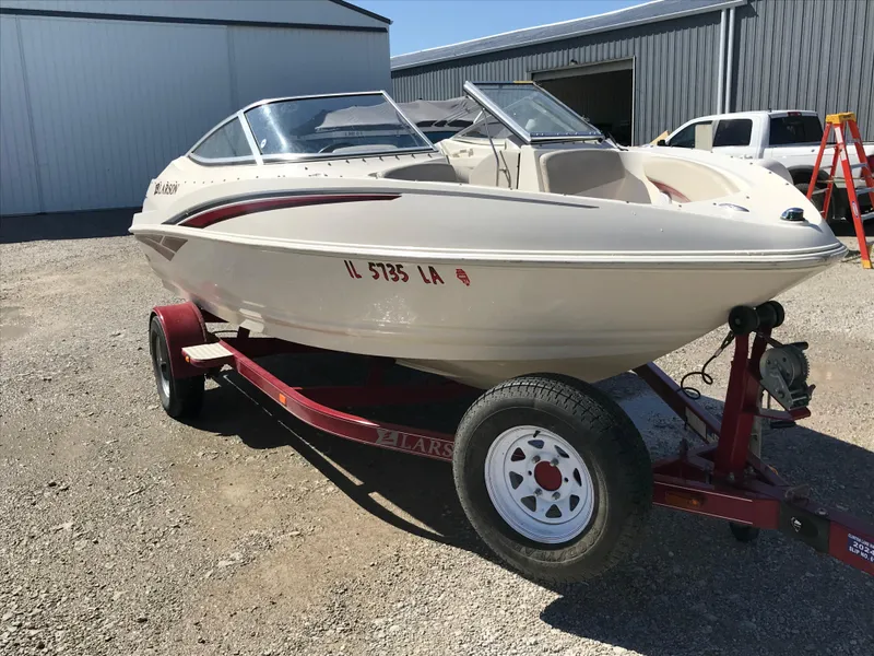 Slide: The Image of 2005 Larson Senza 186 I/O boat on trailer in outdoor setting. - 6