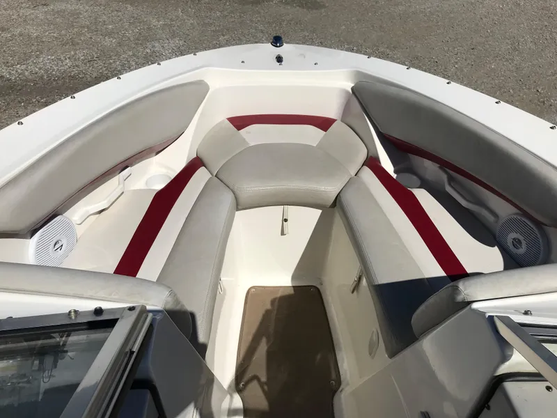 Slide: The Image of 2005 Larson Senza 186 I/O boat interior with red and gray seating. - 7
