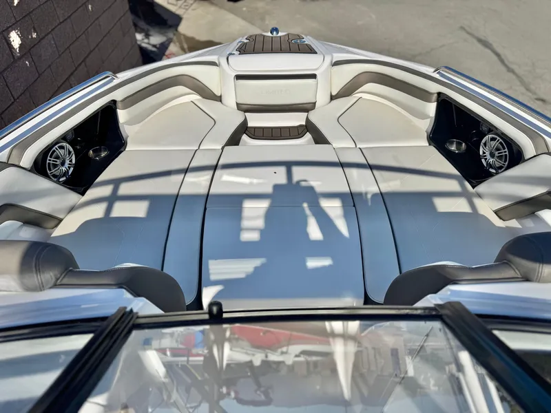 Slide: The Image of 2016 Yamaha Boats 242 Limited E-Series interior with plush seating and speakers. - 14