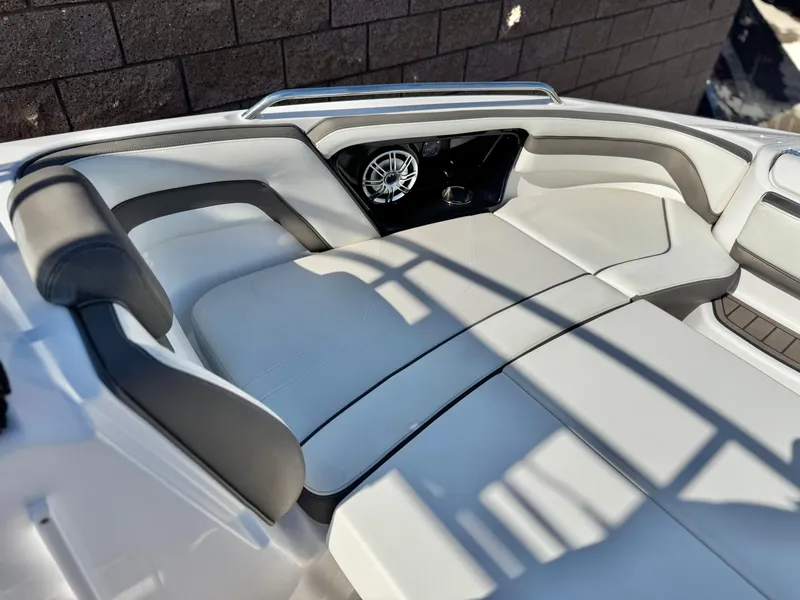 Slide: The Image of 2016 Yamaha Boats 242 Limited E-Series interior with cushioned seating and speaker. - 19