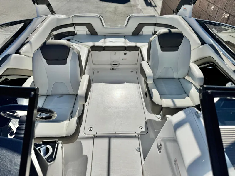 Slide: The Image of 2016 Yamaha Boats 242 Limited E-Series interior with dual seats and sleek design. - 21