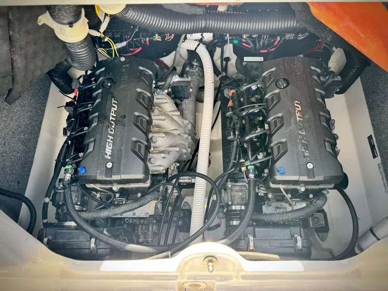 Slide: The Image of 2016 Yamaha Boats 242 Limited E-Series engine compartment with dual high-output engines. - 25
