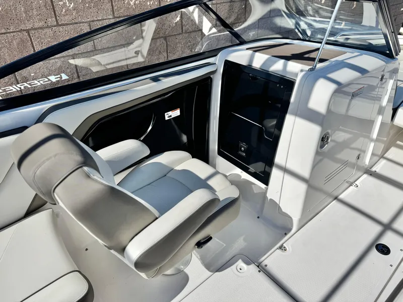 Slide: The Image of 2016 Yamaha Boats 242 Limited E-Series interior with helm seat and dashboard. - 27