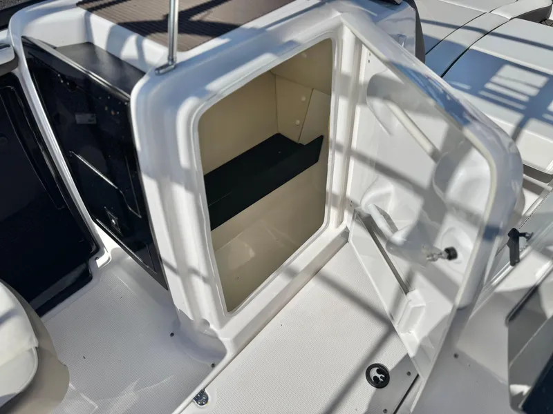 Slide: The Image of Open storage compartment on 2016 Yamaha Boats 242 Limited E-Series. - 28