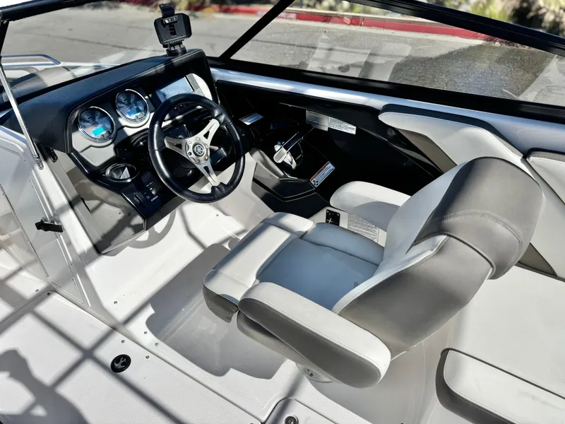 Slide: The Image of 2016 Yamaha Boats 242 Limited E-Series cockpit with steering wheel and dashboard controls. - 30
