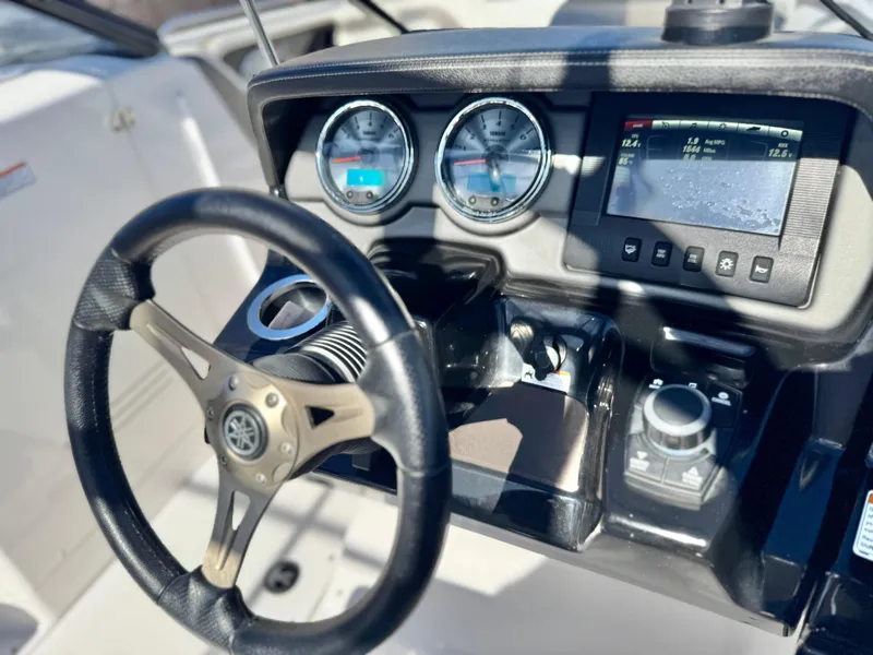 Slide: The Image of Steering console of 2016 Yamaha Boats 242 Limited E-Series with gauges and display. - 32