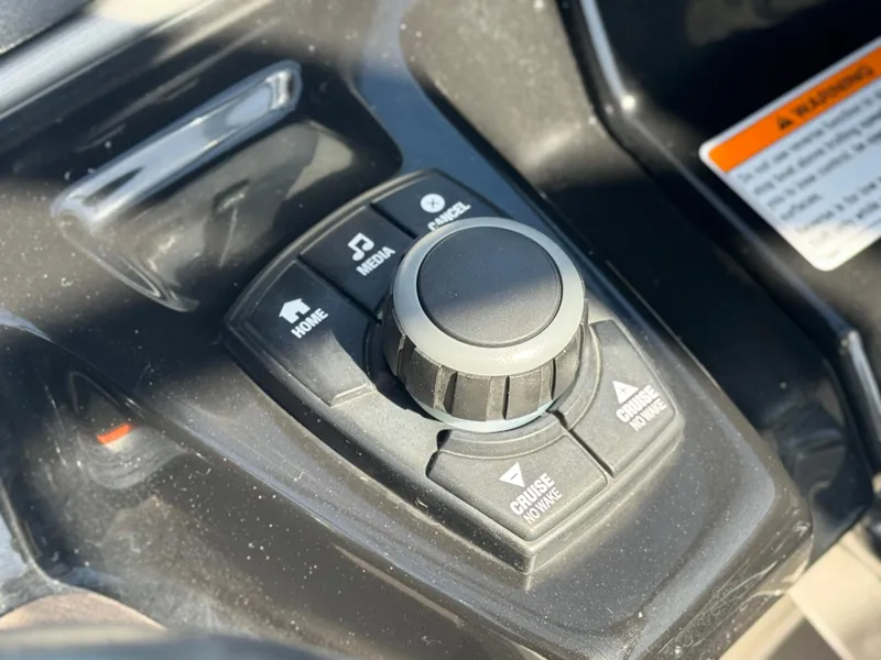 Slide: The Image of Control panel of 2016 Yamaha Boats 242 Limited E-Series with navigation and media buttons. - 33