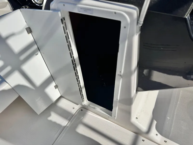 Slide: The Image of Open storage compartment on 2016 Yamaha Boats 242 Limited E-Series. - 35
