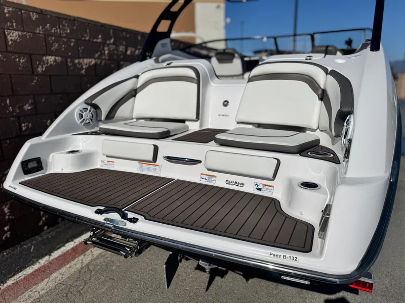 Slide: The Image of 2016 Yamaha Boats 242 Limited E-Series, rear view with seating and swim platform. - 6