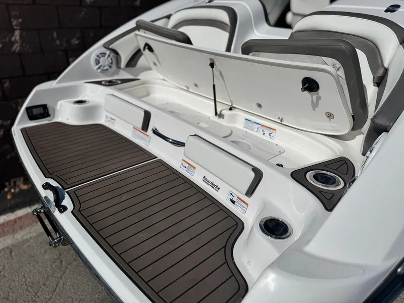 Slide: The Image of 2016 Yamaha Boats 242 Limited E-Series swim platform with storage and seating. - 7